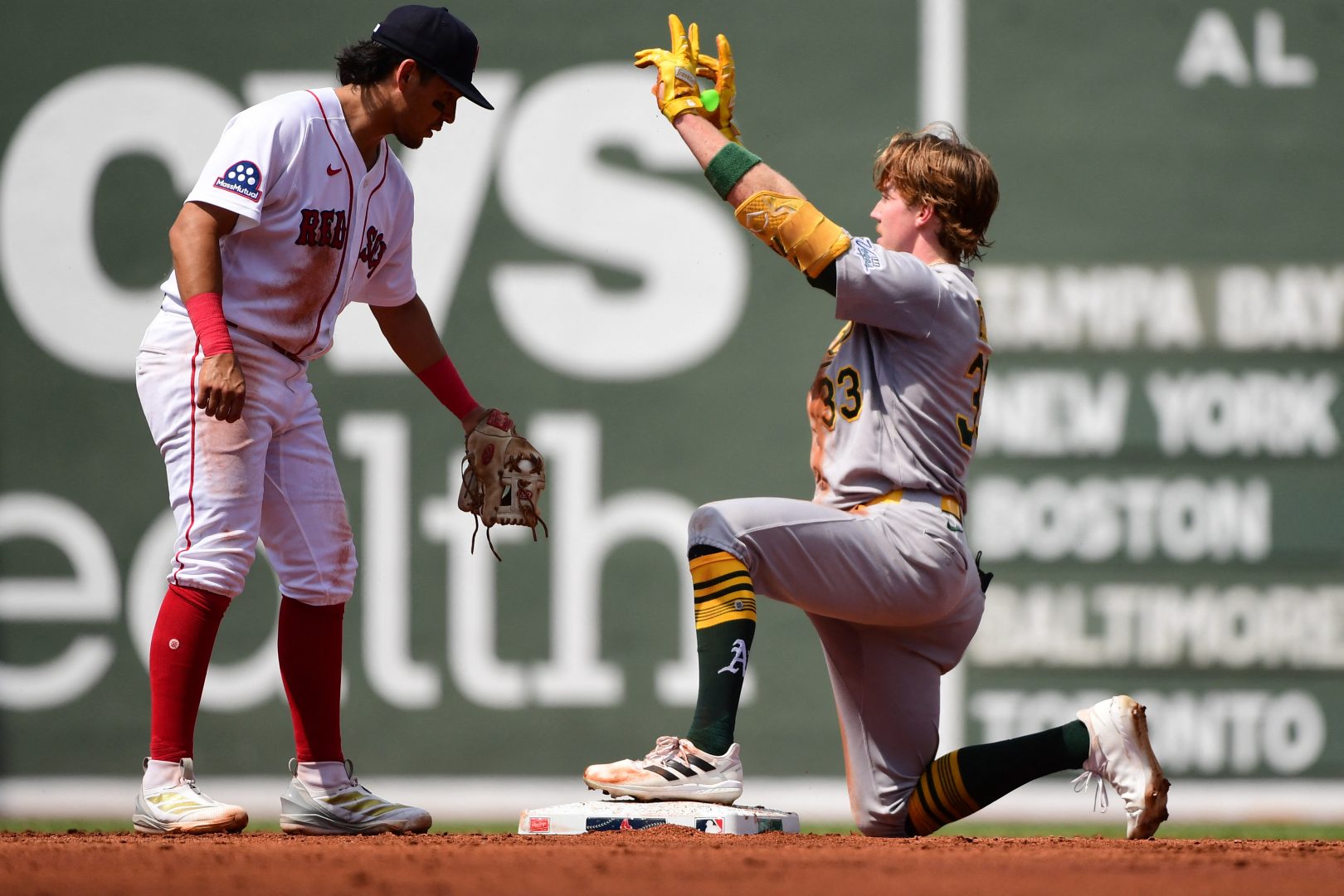 Athletics center fielder Henry Bolte reacts after hitting a double against the Boston Red Sox