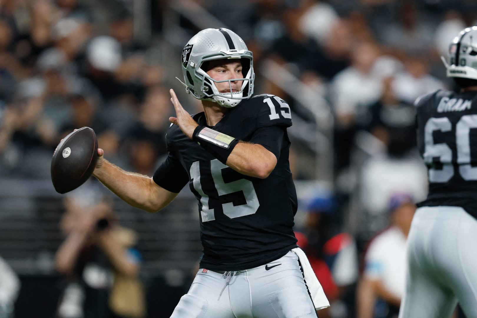 Las Vegas Raiders quarterback Fernando Mendoza throws a pass against the Arizona Cardinals in a preseason game at Allegiant Stadium.