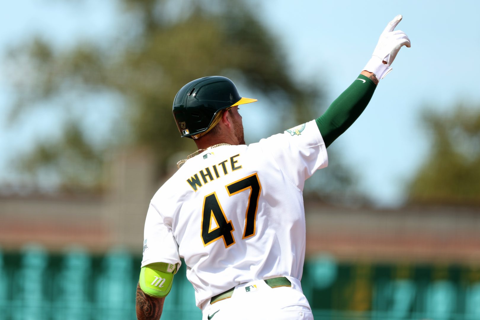 Athletics first baseman Tommy White reacts after hitting his first career home run against the Texas Rangers