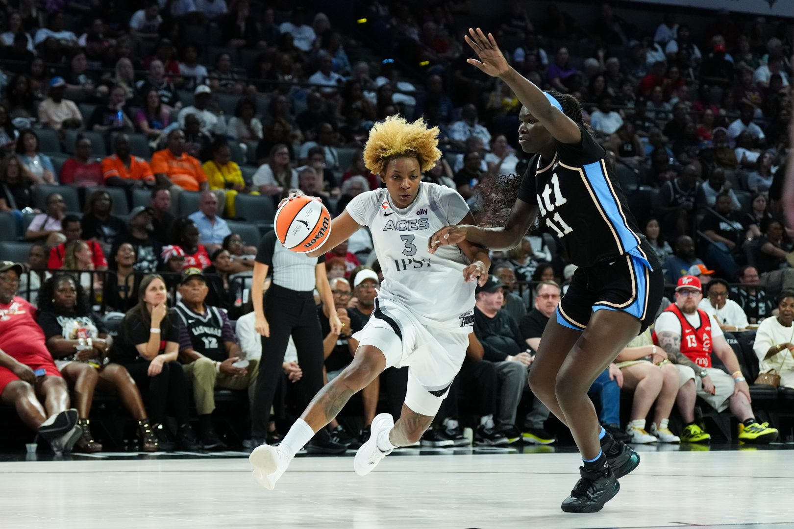 Las Vegas Aces forward NaLyssa Smith drives against Atlanta Dream center Madina Okot