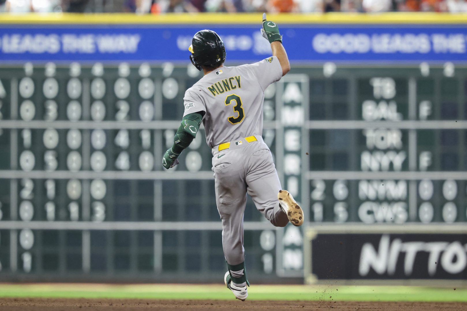 Athletics designated hitter Max Muncy rounds the bases after hitting a home run against the Houston Astros