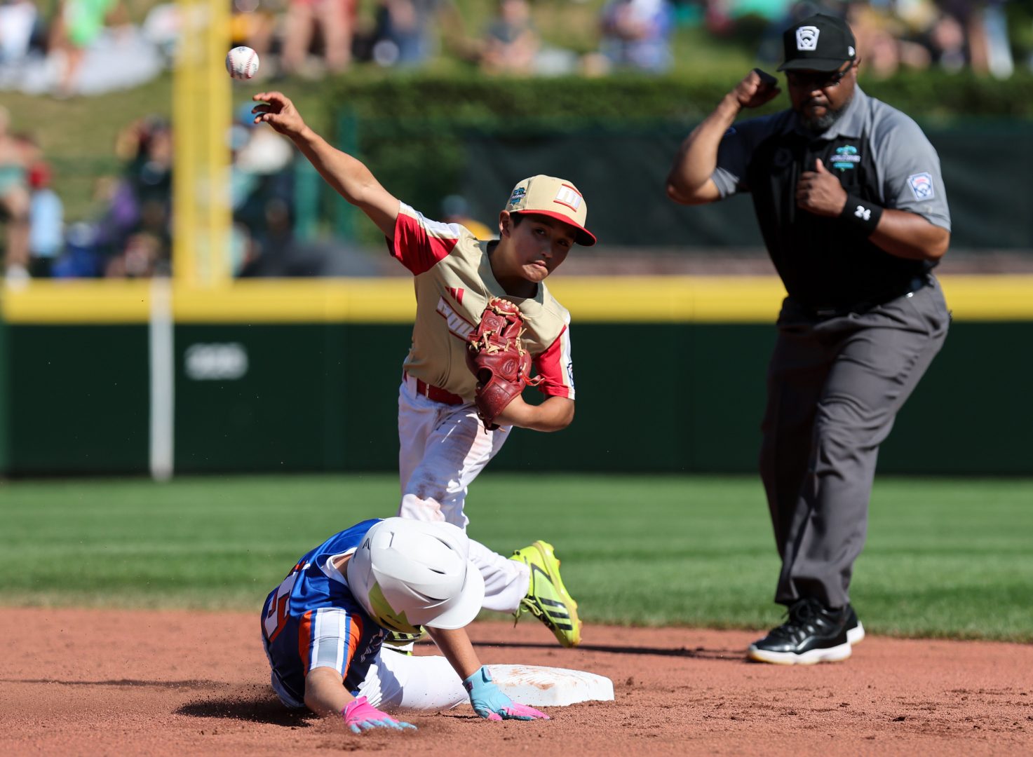 Paseo Verde second baseman Adrian Cruz turns a double play during the Little League World Series