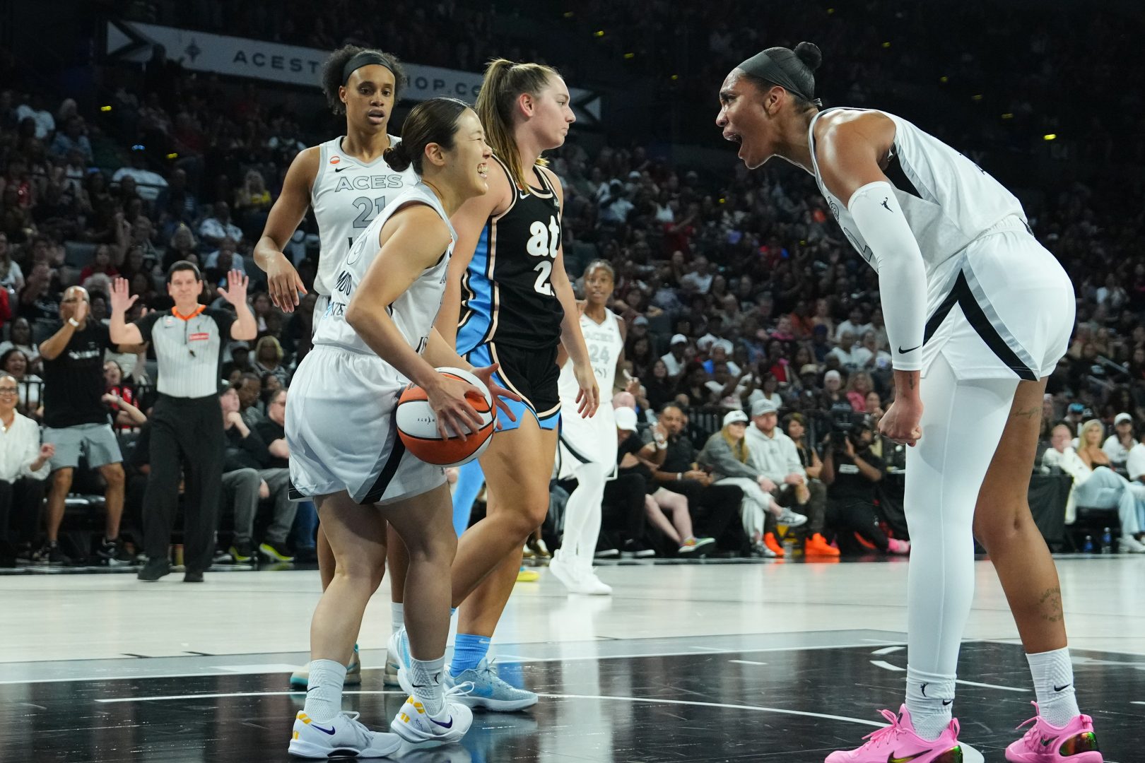 Las Vegas Aces guard Mai Yamamoto and center A'ja Wilson celebrate a play against the Atlanta Dream