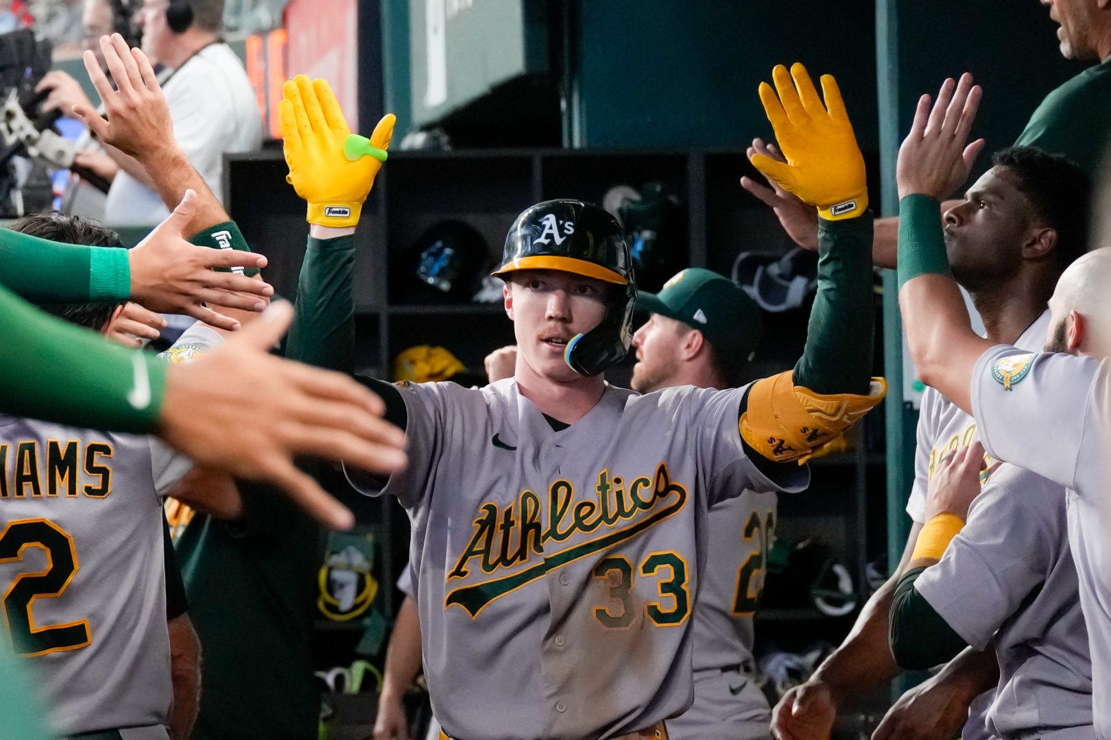 Athletics center fielder Henry Bolte is greeted after hitting his second home run against the Texas Rangers