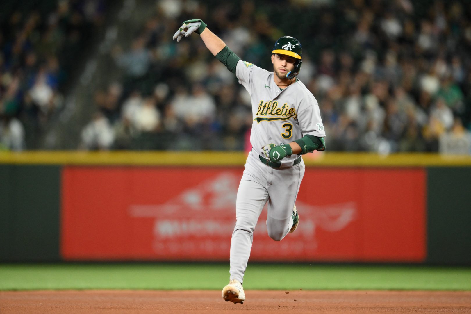 Athletics designated hitter Max Muncy runs the bases after hitting a home run against the Seattle Mariners