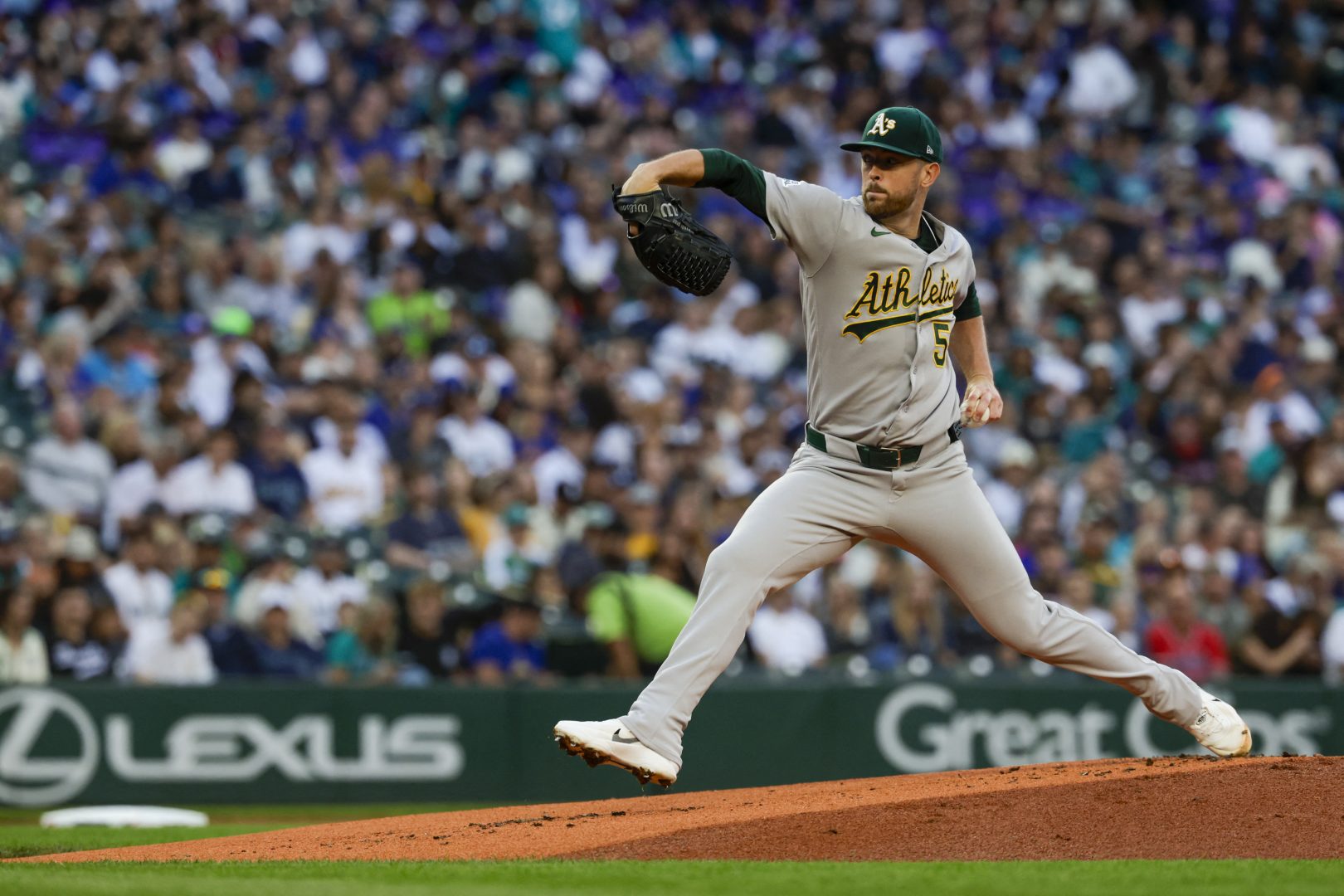 Athletics starting pitcher Jeffrey Springs throws against the Seattle Mariners