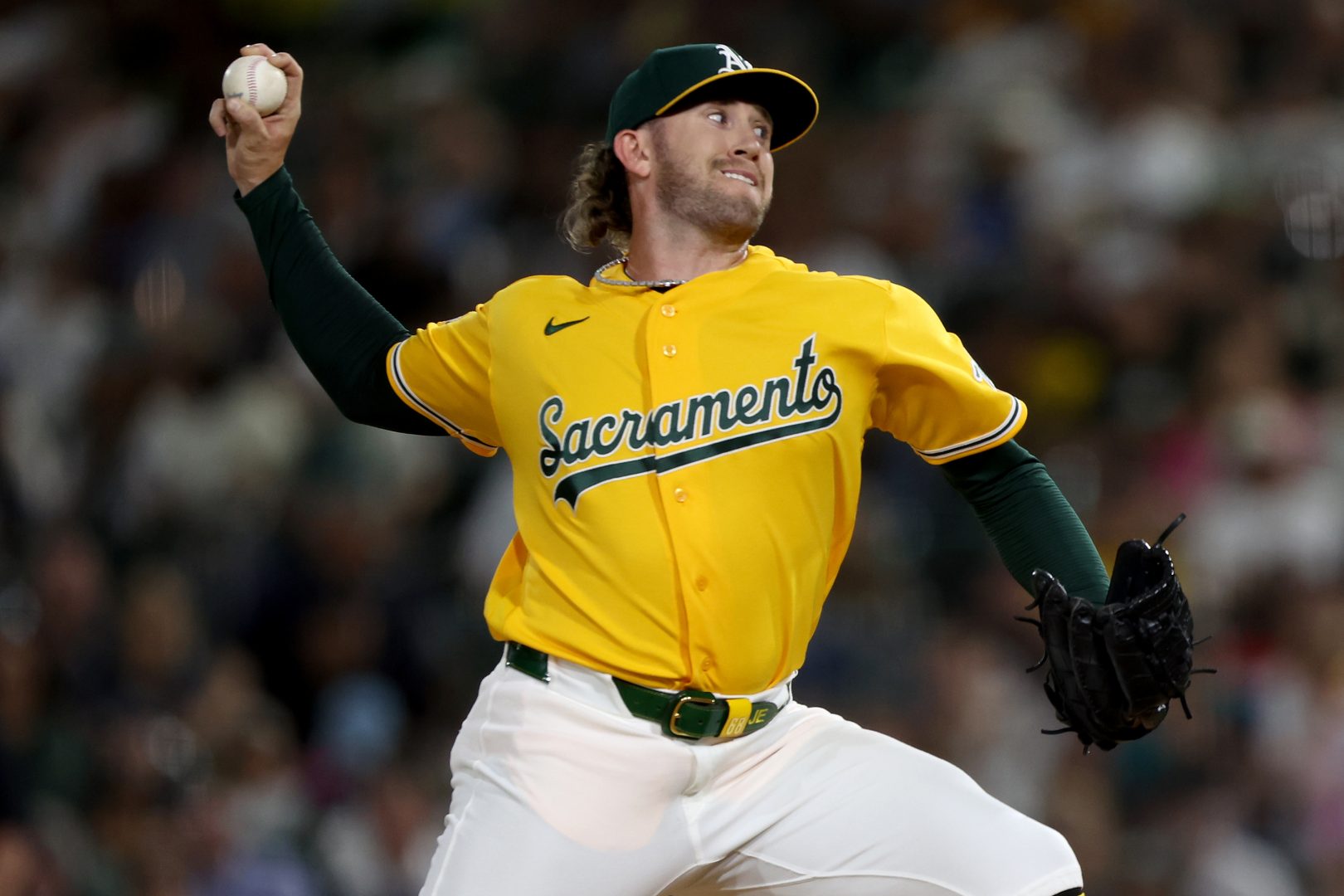 Athletics pitcher Joey Estes throws against the Seattle Mariners