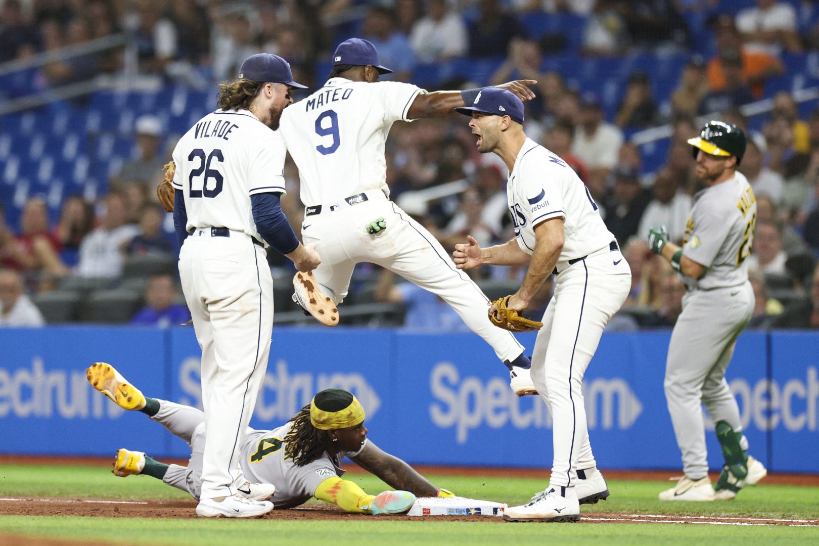 Tampa Bay Rays first baseman Ryan Vilade and pitcher Nick Martinez react after an inning-ending out against the Athletics