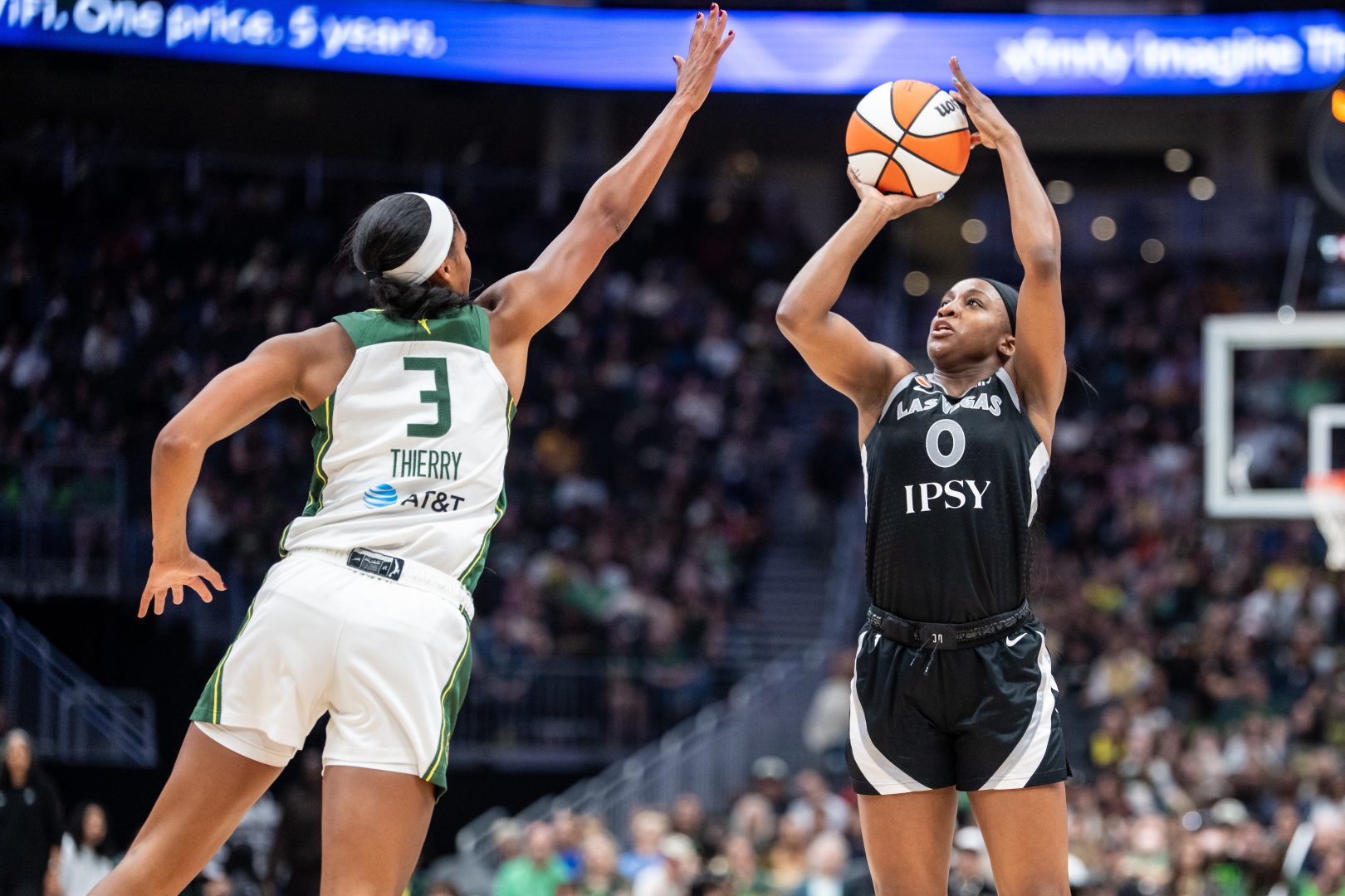 Las Vegas Aces guard Jackie Young shoots against Seattle Storm forward Taylor Thierry