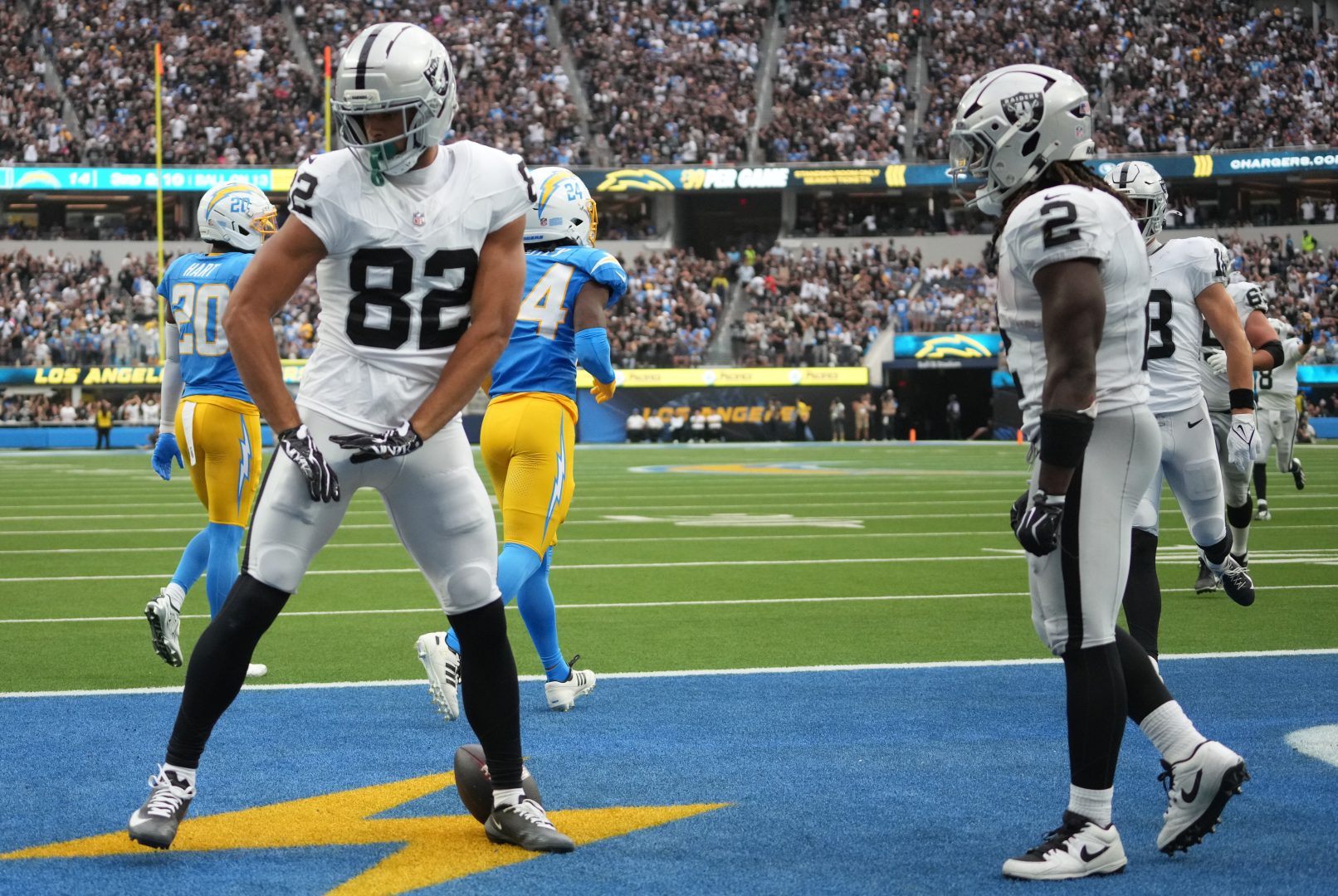 Las Vegas Raiders wide receiver Corey Rucker and running back Ashton Jeanty celebrate after a touchdown against the Los Angeles Chargers