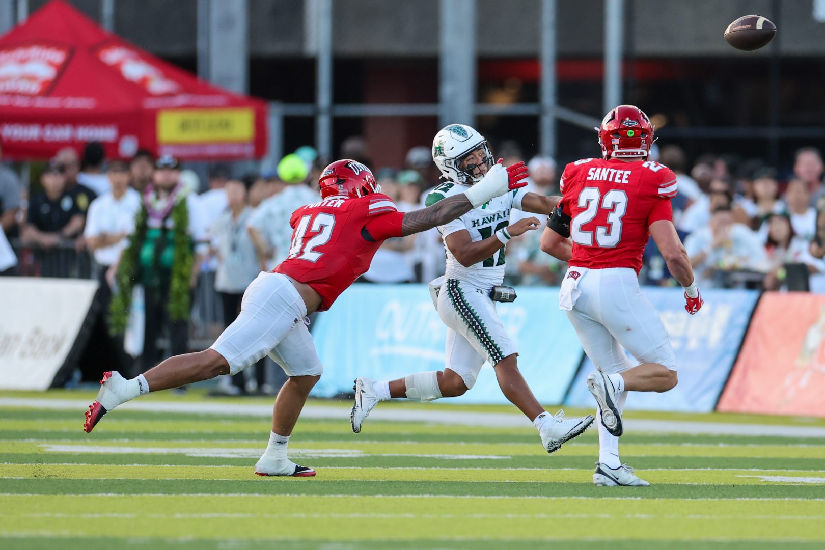 UNLV outside linebacker Andre Porter pressures Hawaii quarterback Micah Alejado during a game at the Clarence T.C. Ching Athletics Complex.