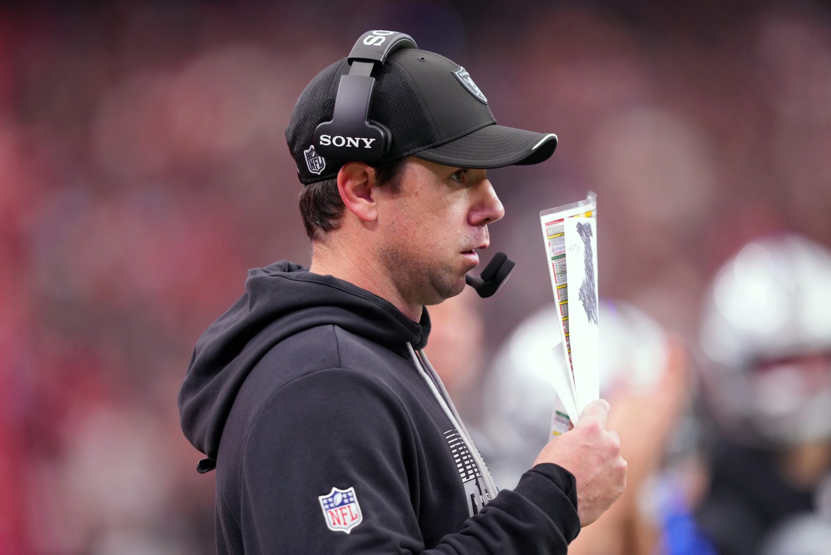 Las Vegas Raiders head coach Klint Kubiak watches the game against the Kansas City Chiefs at Allegiant Stadium