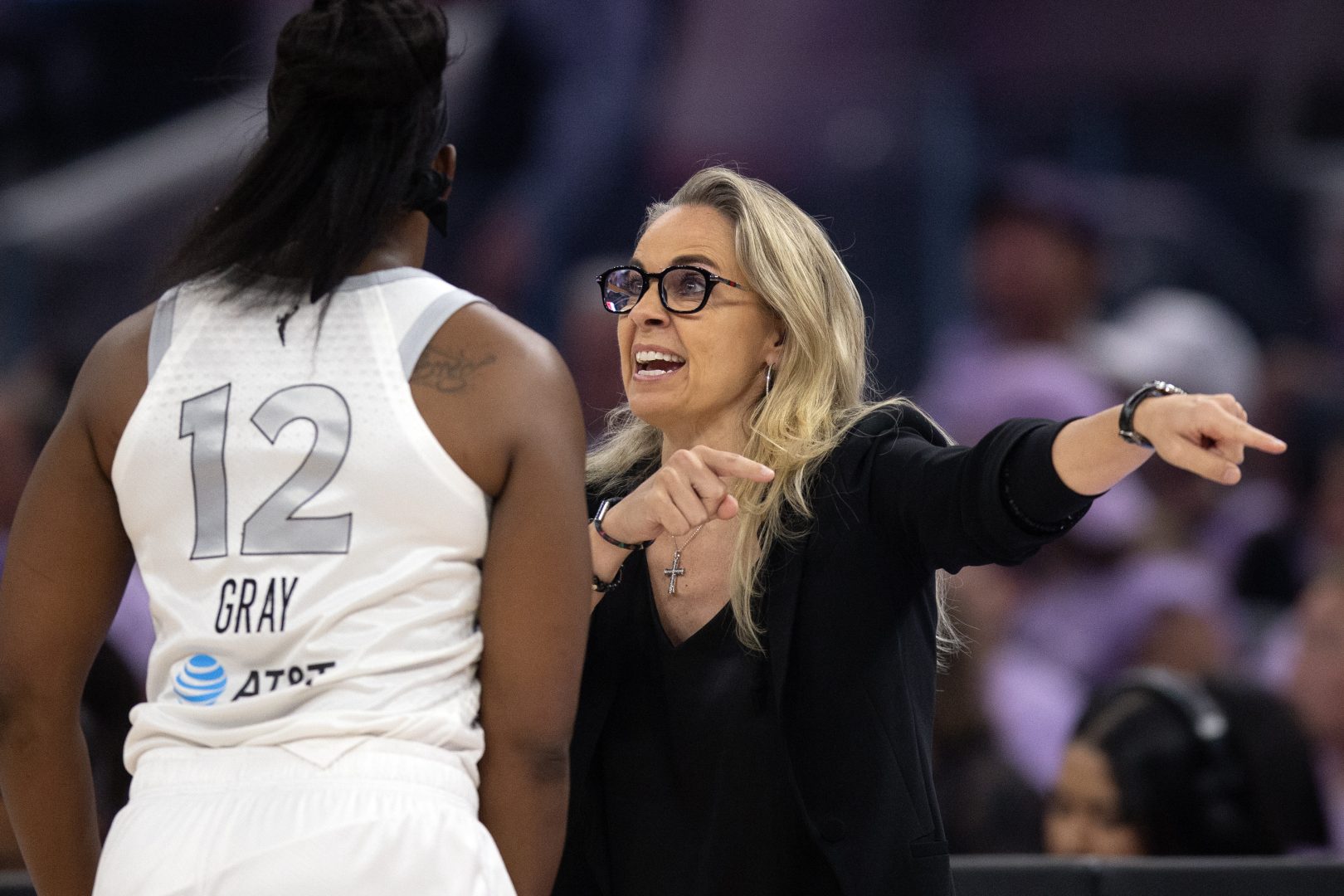Las Vegas Aces head coach Becky Hammon talks with guard Chelsea Gray during Game 1 against the Golden State Valkyries
